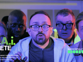 Five adults stand close together, looking surprised, under blue and purple lighting with text overlay about a film project.