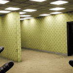 First-person view of leather-gloved hands in a room with yellow patterned wallpaper, a dark doorway, and a staircase.